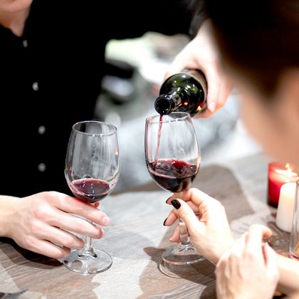 young-couple-celebrating-valentine-s-day-while-having-lunch-and-wine-together-001web